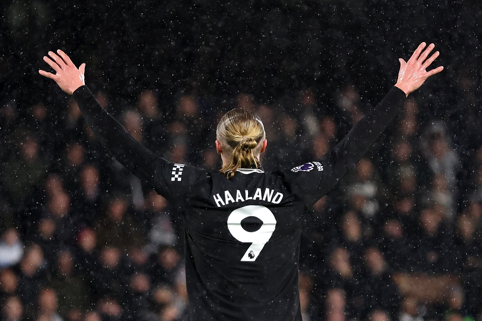 Erling Haaland of Man City celebrates scoring his team's first goal, making him the fastest Premier League player to score 100 goals during the Premier League match between Fulham and Manchester City at Craven Cottage on December 02, 2025 in London, England.