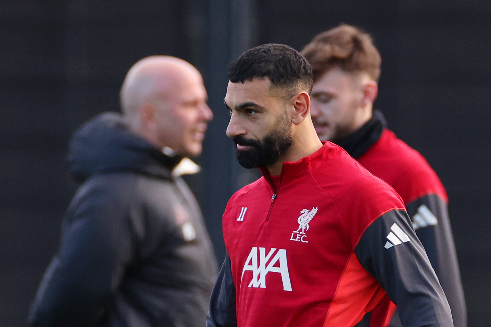 Mo Salah of Liverpool looks on as Arne Slot, Manager of Liverpool, is seen during a Liverpool Training Session at AXA Training Centre on December 08, 2025 in Kirkby, England.