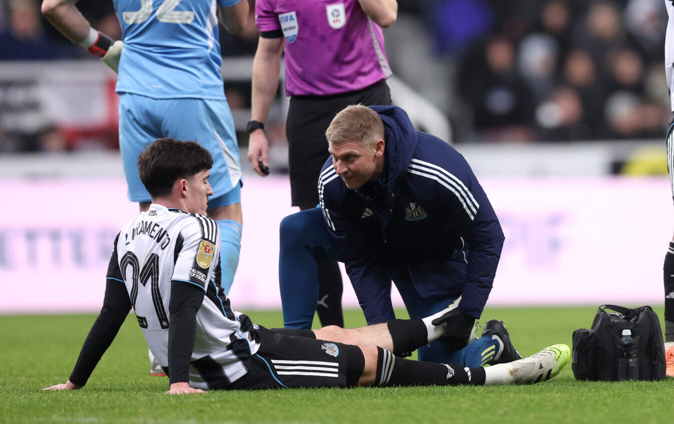 Tino Livramento of Newcastle United receives medical treatment during the Carabao Cup Quarter Final match between Newcastle United and Fulham at St James' Park on December 17, 2025 in Newcastle upon Tyne, England.