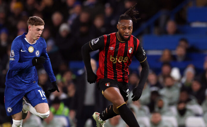 Antoine Semenyo of AFC Bournemouth runs with the ball whilst under pressure from Cole Palmer of Chelsea during the Premier League match between Chelsea and Bournemouth at Stamford Bridge on December 30, 2025 in London, England.