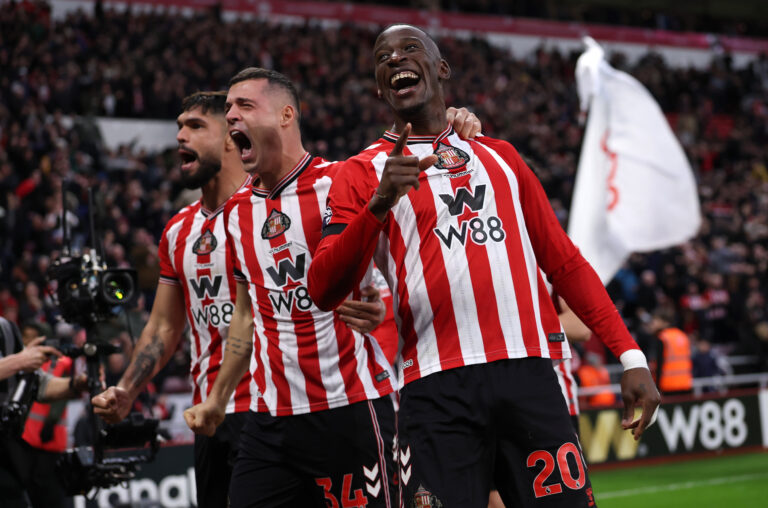 Sunderland players Omar Alderete (L), Granit Xhaka (C) and Nordi Mukiele (R) of Sunderland celebrate the teams first goal, an own goal, conceded by Nick Woltemade of Newcastle United (not pictured) during the Premier League match between Sunderland and Newcastle United at Stadium of Light on December 14, 2025 in Sunderland, England.