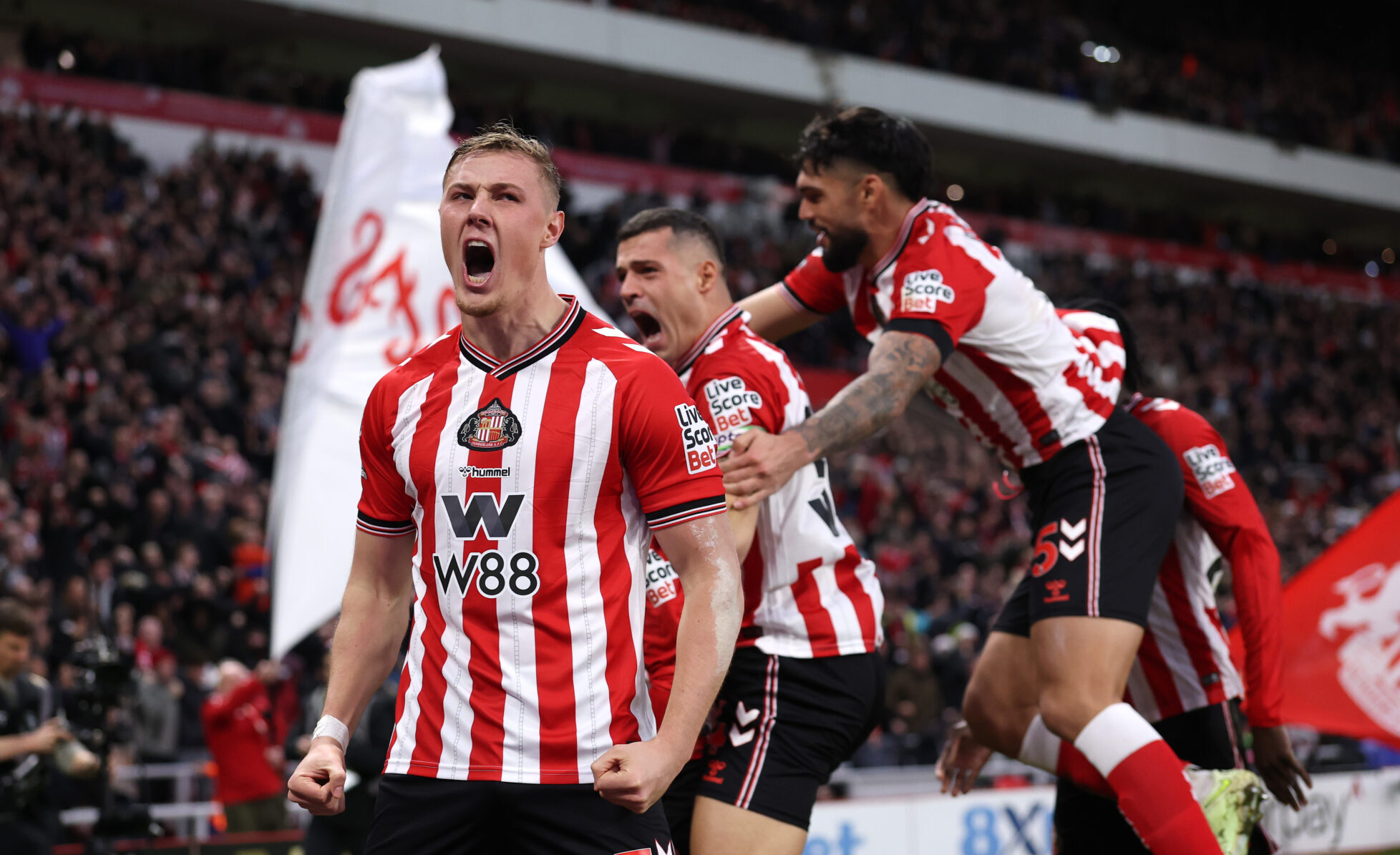 Sunderland defender Daniel Ballard celebrates the teams first goal, an own goal, conceded by Nick Woltemade of Newcastle United (not pictured) during the Premier League match between Sunderland and Newcastle United at Stadium of Light on December 14, 2025 in Sunderland, England.
