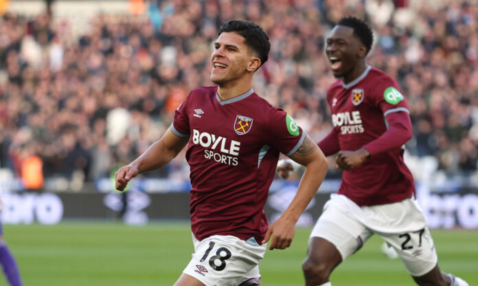 Mateus Fernandes of West Ham United celebrates scoring his team's first goal during the Premier League match between West Ham United and Aston Villa at London Stadium on December 14, 2025 in London, England.