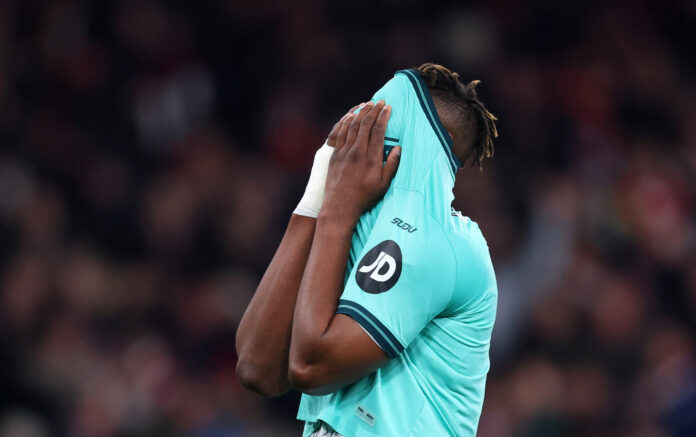Emmanuel Agbadou of Wolves reacts after losing to Arsenal in the Premier League match between Arsenal and Wolverhampton Wanderers at Emirates Stadium on December 13, 2025 in London, England.