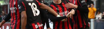 AC Milan player Christian Pulisic celebrates a goal with his teammates.