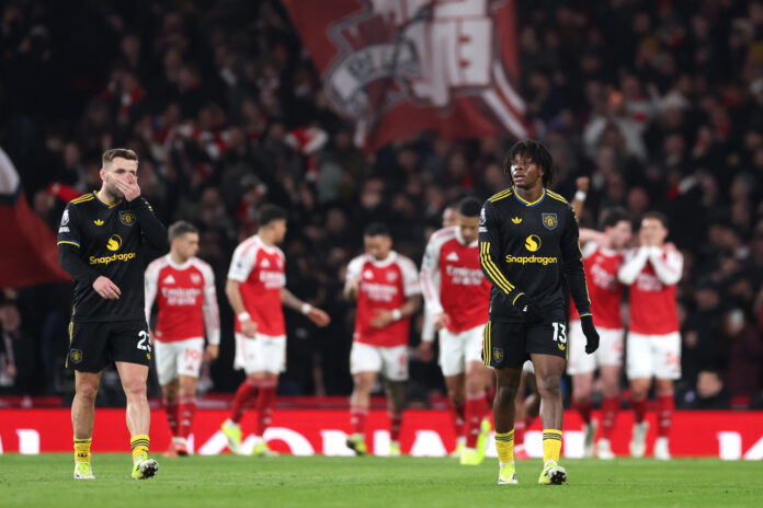 Patrick Dorgu of Man United looks dejected after teammate Lisandro Martinez (not pictured) scores an own-goal during the Premier League match between Arsenal and Manchester United at Emirates Stadium on January 25, 2026 in London, England.
