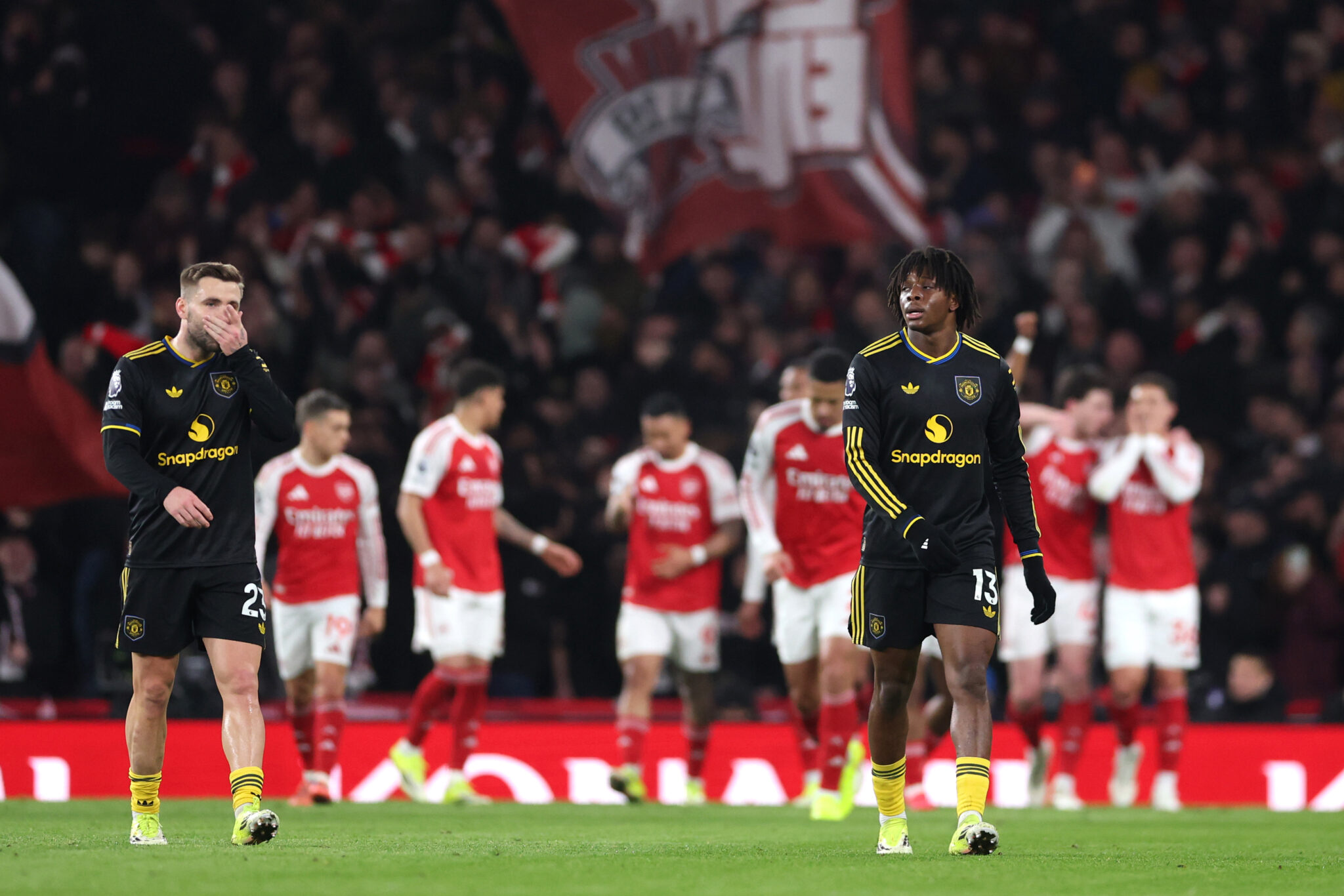 Patrick Dorgu of Man United looks dejected after teammate Lisandro Martinez (not pictured) scores an own-goal during the Premier League match between Arsenal and Manchester United at Emirates Stadium on January 25, 2026 in London, England.