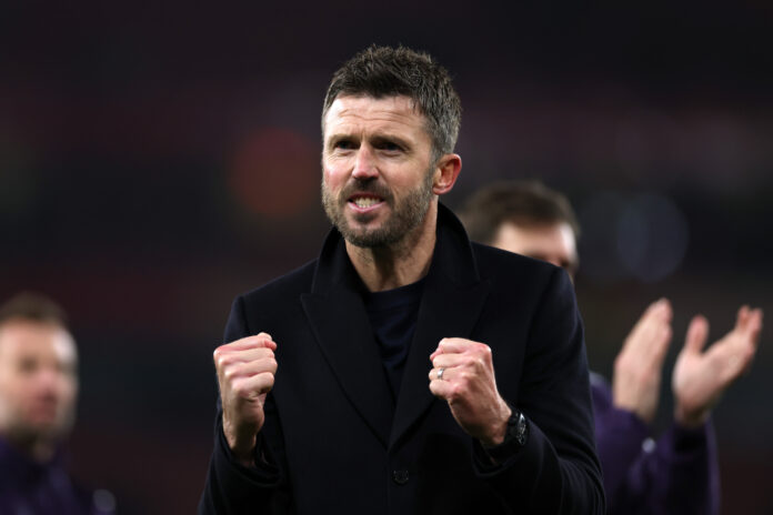 Michael Carrick, Head Coach of Man Utd, celebrates as he shows appreciation to the fans following the team's victory in the Premier League match between Arsenal and Manchester United at Emirates Stadium on January 25, 2026 in London, England.