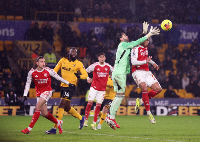 David Raya of Arsenal and Gabriel of Arsenal in the build up to Wolverhampton Wanderers second goal during the Premier League match between Wolverhampton Wanderers and Arsenal at Molineux on February 18, 2026 in Wolverhampton, England.
