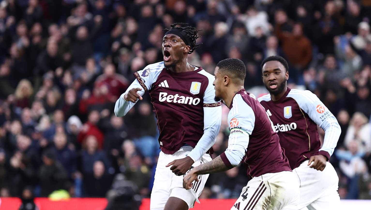 Tammy Abraham of Aston Villa celebrates scoring his team's first goal during the Premier League match between Aston Villa and Leeds United at Villa Park on February 21, 2026 in Birmingham, England.