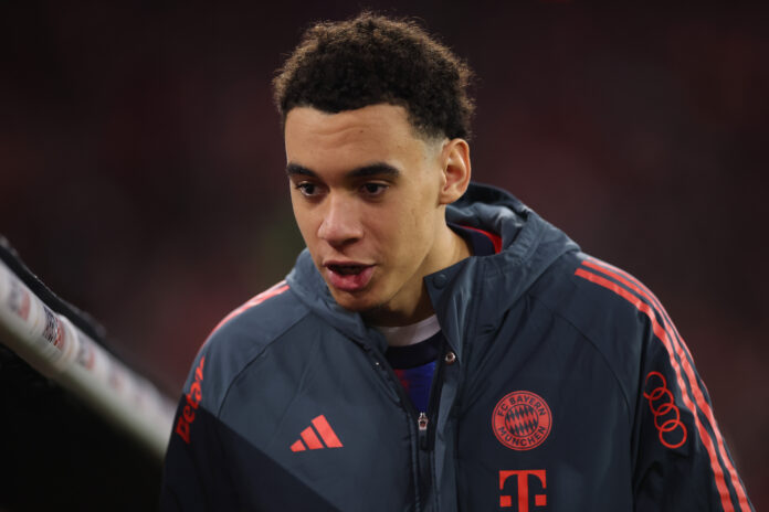 Jamal Musiala of FC Bayern Munich arrives for the DFB Cup Quarter Final match between FC Bayern München and RB Leipzig at Allianz Arena on February 11, 2026 in Munich, Germany.