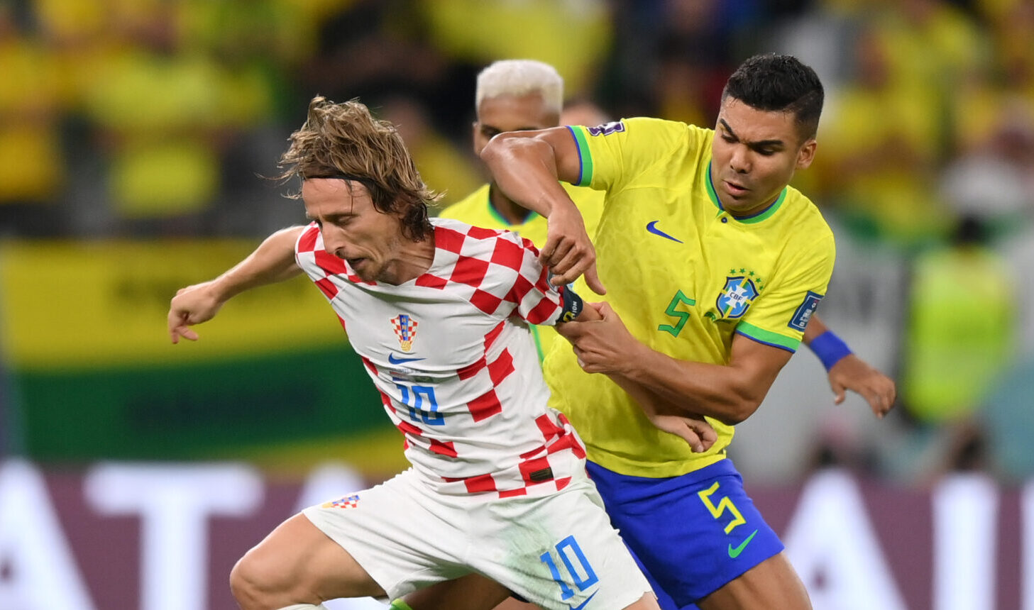 Luka Modric of Croatia holds off Casemiro of Brazil during the FIFA World Cup Qatar 2022 quarter final match between Croatia and Brazil at Education City Stadium on December 09, 2022 in Al Rayyan, Qatar.