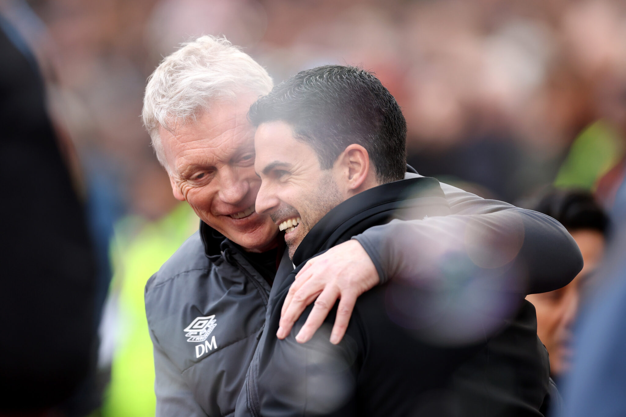 David Moyes, currently Manager of Everton, embraces Mikel Arteta, Manager of Arsenal, prior to the Premier League match between West Ham United and Arsenal FC at London Stadium on February 11, 2024 in London, England.