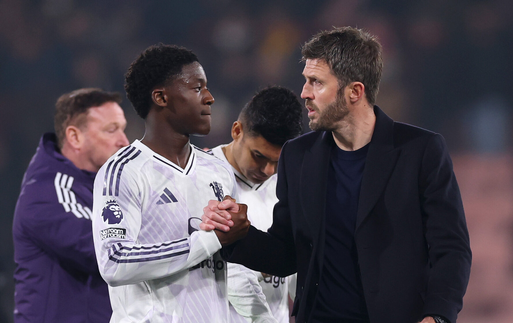 Michael Carrick, Manager of Manchester United, shakes hands with Kobbie Mainoo of Manchester United after the Premier League match between Bournemouth and Manchester United at Vitality Stadium on March 20, 2026 in Bournemouth, England.
