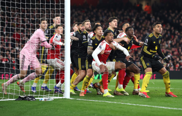Gabriel of Arsenal is held by Lisandro Martinez of Manchester United for an oncoming corner during the Premier League match between Arsenal and Manchester United at Emirates Stadium on January 25, 2026 in London, England.