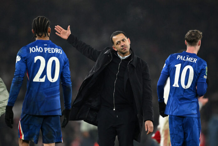 Liam Rosenior, Manager of Chelsea, interacts with Joao Pedro after the Carabao Cup Semi Final Second Leg match between Arsenal and Chelsea at Emirates Stadium on February 03, 2026 in London, England.