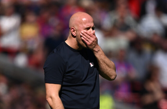 Arne Slot, Manager of Liverpool, reacts during the Premier League match between Liverpool and Crystal Palace at Anfield on April 25, 2026 in Liverpool, England.
