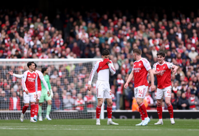 Arsenal players Kai Havertz and Declan Rice react after their team concedes a goal during the Premier League match between Arsenal and Bournemouth at Emirates Stadium on April 11, 2026 in London, England.