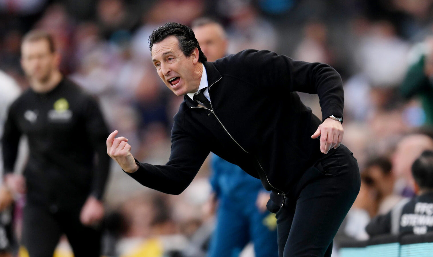 Unai Emery, Manager of Aston Villa, throws the ball back into play during the Premier League match between Fulham and Aston Villa at Craven Cottage on April 25, 2026 in London, England.
