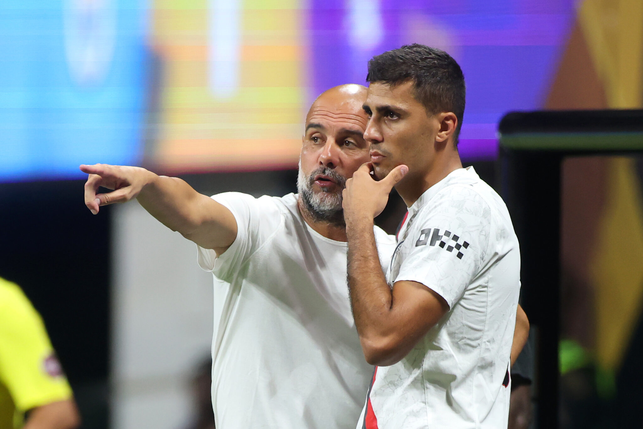 Pep Guardiola, Head Coach of Manchester City, gives Rodri #16 instructions during the FIFA Club World Cup 2025 group G match between Man City FC and Al Ain FC at Mercedes-Benz Stadium on June 22, 2025 in Atlanta, Georgia.