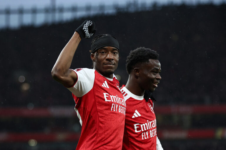 Noni Madueke of Arsenal celebrates with teammate Bukayo Saka after scoring his team's first goal during the Emirates FA Cup Fourth Round match between Arsenal and Wigan Athletic at the Emirates Stadium on February 15, 2026 in London, England.