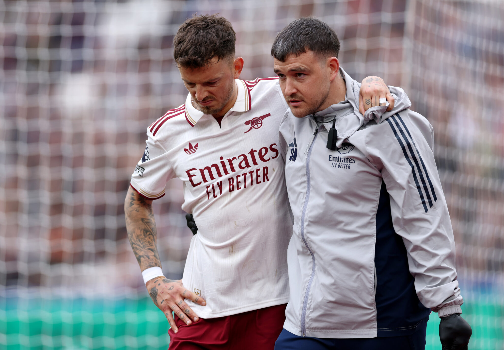 Arsenal player Ben White leaves the pitch after picking up an injury during the Premier League match between West Ham United and Arsenal at London Stadium on May 10, 2026 in London, England.