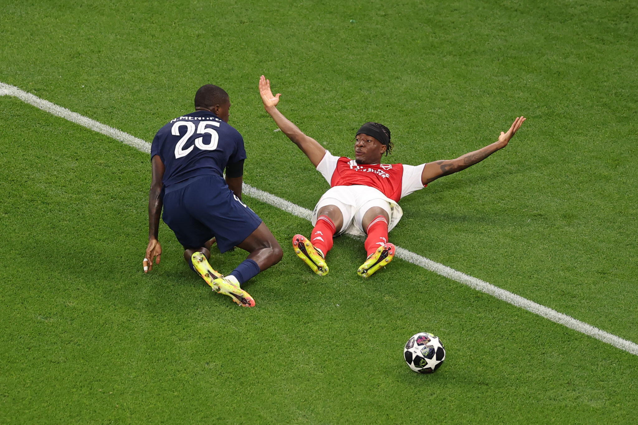 Arsenal player Noni Madueke reacts as he goes down following a challenge from Nuno Mendes of PSG during the UEFA Champions League Final 2026 match between Paris Saint-Germain and Arsenal FC at Puskas Arena on May 30, 2026 in Budapest, Hungary.