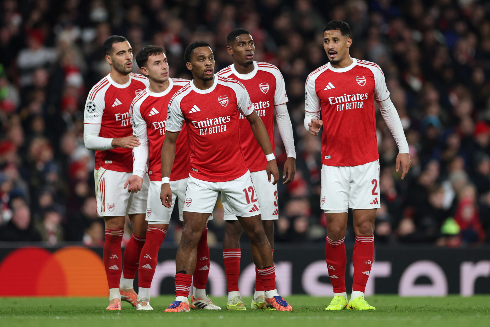Arsenal players Mikel Merino, Martin Zubimendi, Cristhian Mosquera, William Saliba and Jurrien Timber line up as they prepare to attack a cross during the UEFA Champions League 2025/26 League Phase MD5 match between Arsenal FC and FC Bayern München at Arsenal Stadium on November 26, 2025 in London, England.