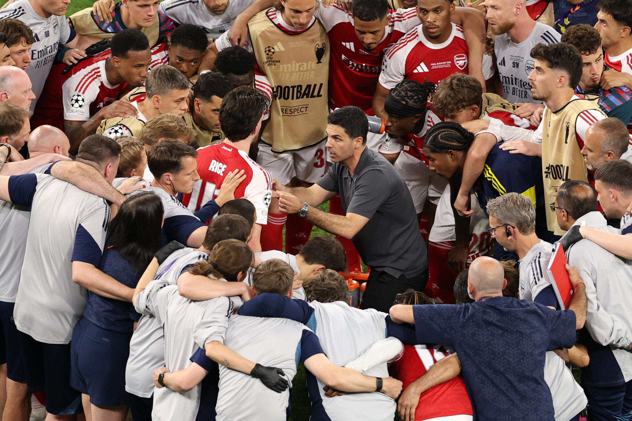 Mikel Arteta, Manager of Arsenal, speaks to his players in a huddle before the penalty shoot out in the UEFA Champions League Final 2026 match between Paris Saint-Germain and Arsenal FC at Puskas Arena on May 30, 2026 in Budapest, Hungary.