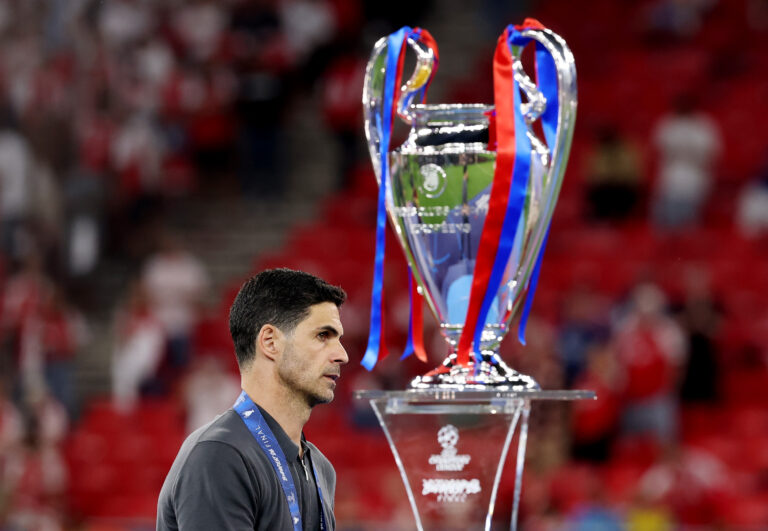 Mikel Arteta, Manager of Arsenal, walks past the UEFA Champions League trophy following the UEFA Champions League Final 2026 match between Paris Saint-Germain and Arsenal FC at Puskas Arena on May 30, 2026 in Budapest, Hungary.