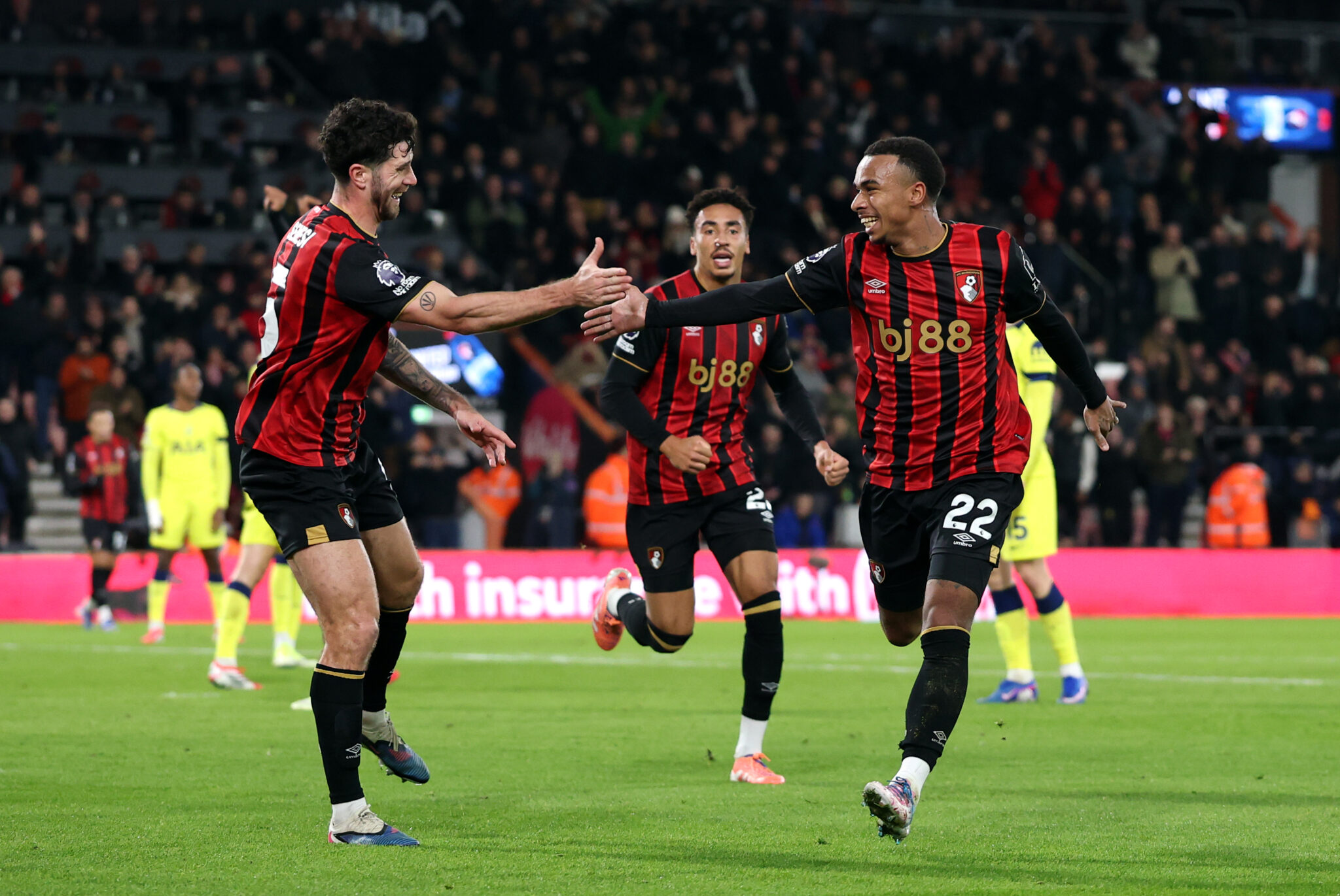 Bournemouth player Eli Junior Kroupi celebrates scoring his team's second goal with teammate Marcos Senesi during the Premier League match between Bournemouth and Tottenham Hotspur at Vitality Stadium on January 07, 2026 in Bournemouth, England.