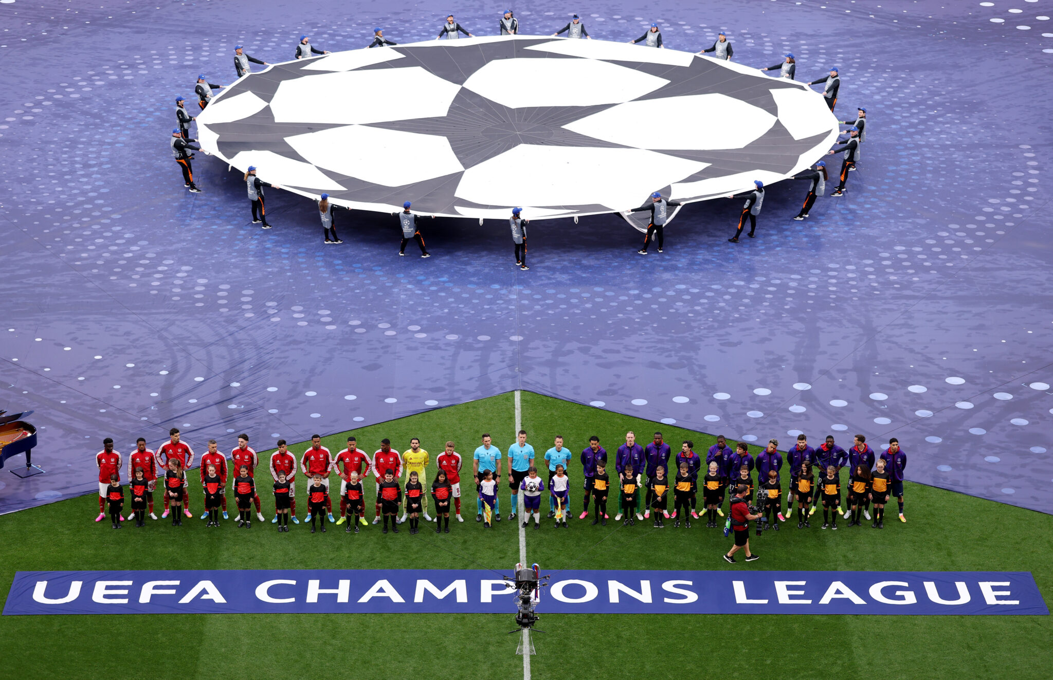 Arsenal and PSG players lining up on the pitch prior to the UEFA Champions League Final 2026 match between Paris Saint-Germain and Arsenal FC at Puskas Arena on May 30, 2026 in Budapest, Hungary.
