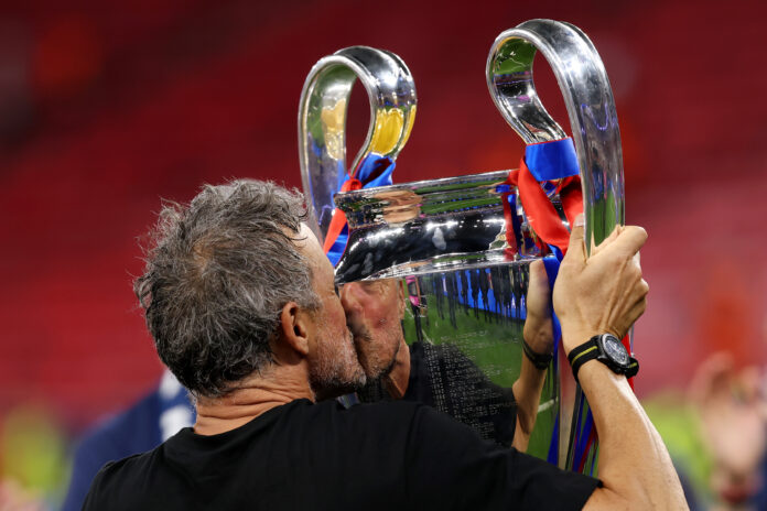 PSG manager Luis Enrique kisses the UEFA Champions League trophy after his team's victory in the UEFA Champions League Final 2026 match between Paris Saint-Germain and Arsenal FC at Puskas Arena on May 30, 2026 in Budapest, Hungary.