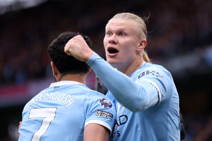 Erling Haaland of Man City celebrates scoring his team's second goal with teammate Omar Marmoush during the Premier League match between Manchester City and Brentford at Etihad Stadium on May 09, 2026 in Manchester, England.