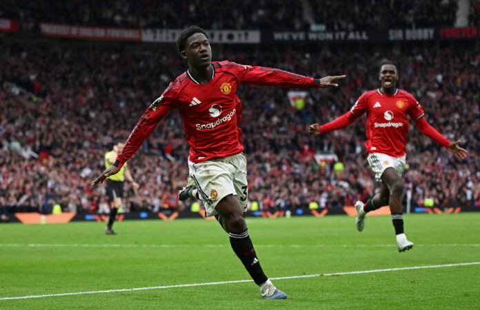 Kobbie Mainoo of Man Utd celebrates scoring his team's third goal during the Premier League match between Manchester United and Liverpool at Old Trafford on May 03, 2026 in Manchester, England.