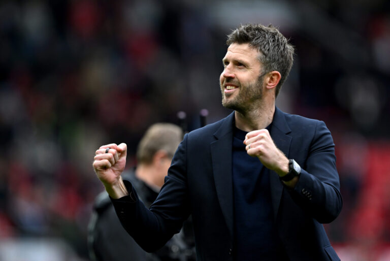 Michael Carrick, Manager of Man United, celebrates victory following the Premier League match between Manchester United and Liverpool at Old Trafford on May 03, 2026 in Manchester, England.
