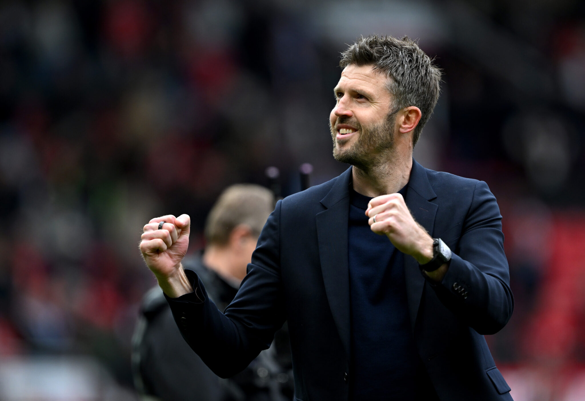 Michael Carrick, Manager of Man United, celebrates victory following the Premier League match between Manchester United and Liverpool at Old Trafford on May 03, 2026 in Manchester, England.