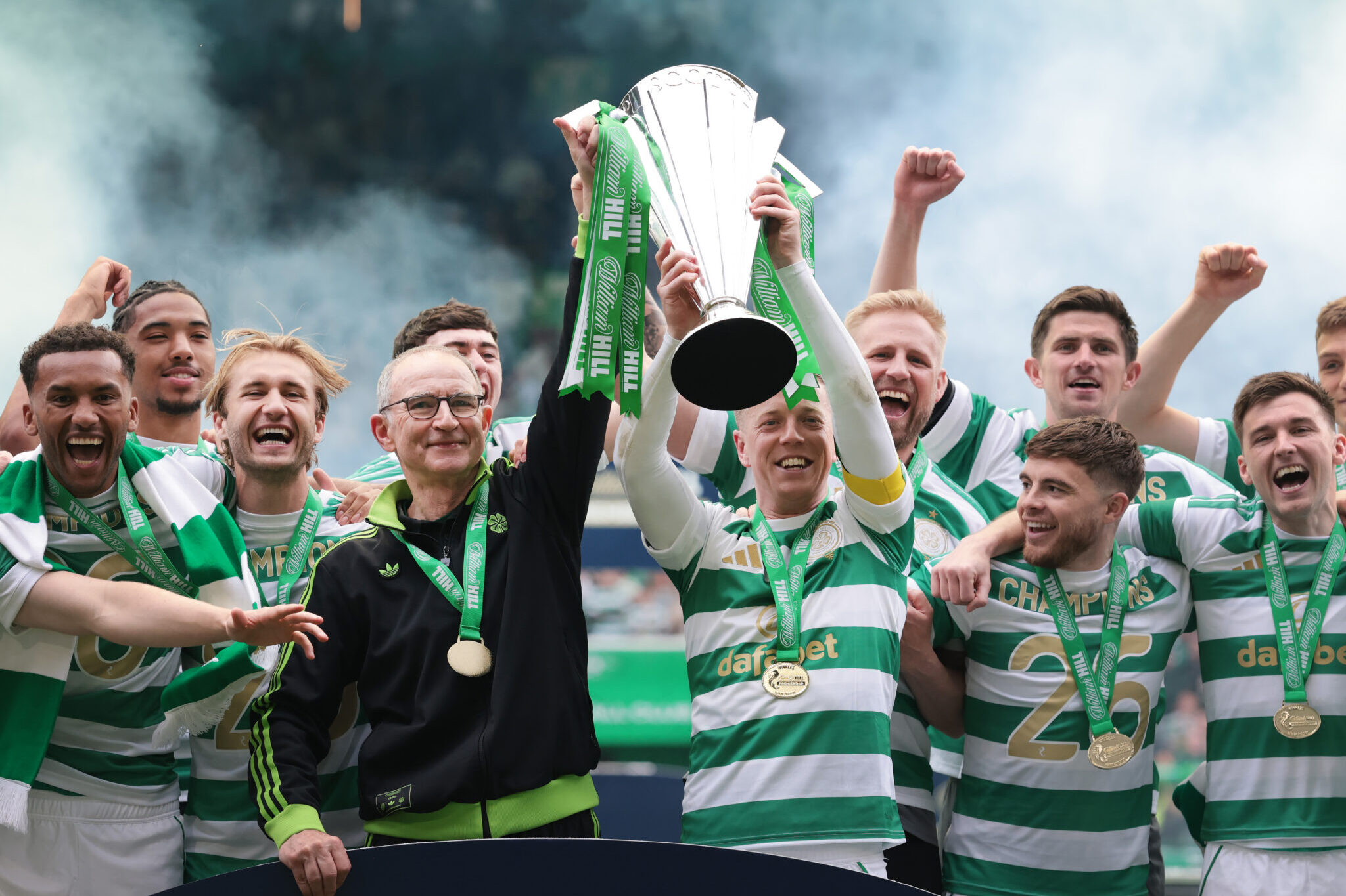 Martin O'Neill, Interim Manager of Celtic lifts the William Hill Premiership trophy with Callum McGregor of Celtic following the team's victory in the William Hill Premiership match between Celtic and Heart of Midlothian at Celtic Park on May 16, 2026 in Glasgow, Scotland.