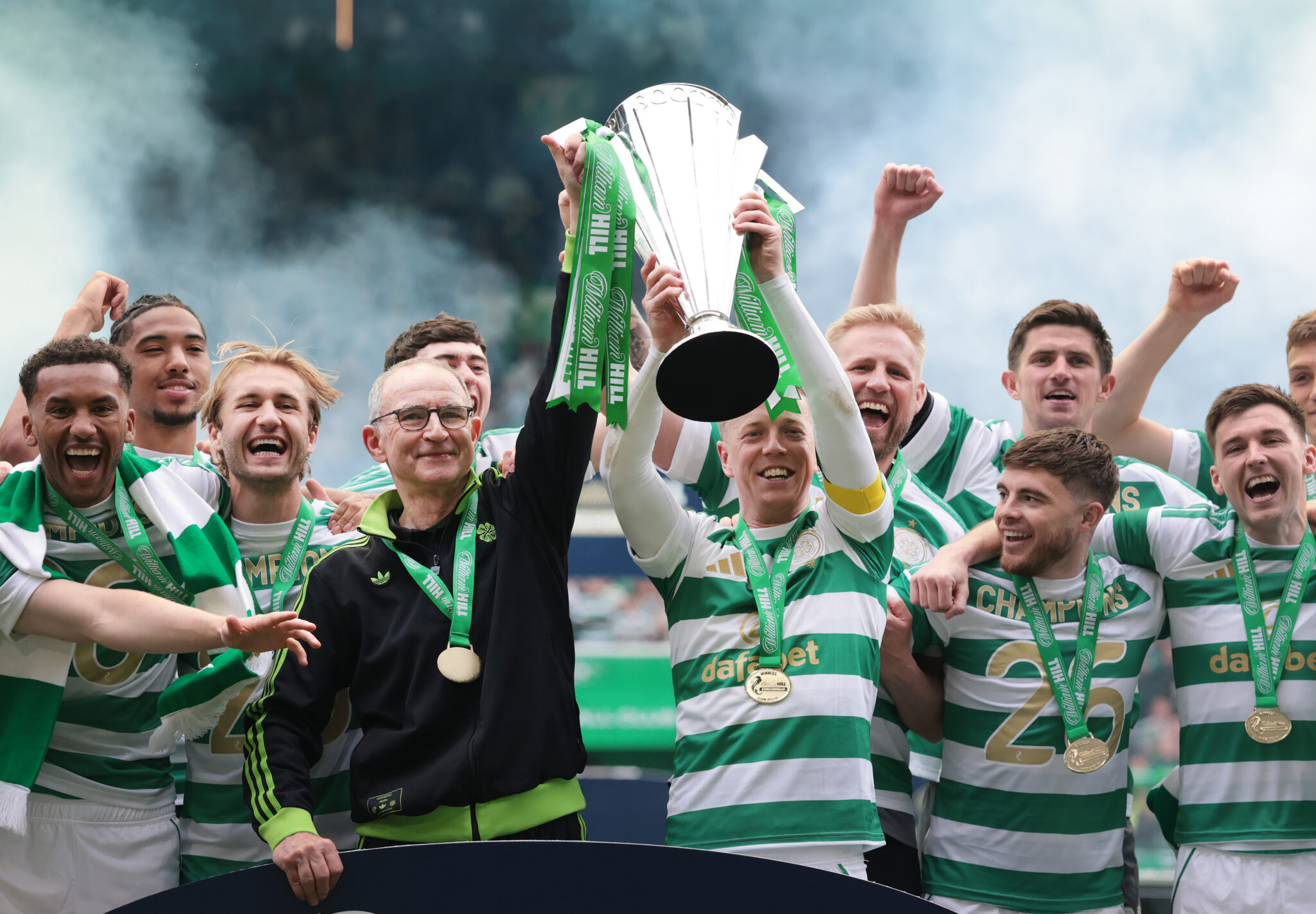Martin O'Neill, Interim Manager of Celtic lifts the William Hill Premiership trophy with Callum McGregor of Celtic following the team's victory in the William Hill Premiership match between Celtic and Heart of Midlothian at Celtic Park on May 16, 2026 in Glasgow, Scotland.