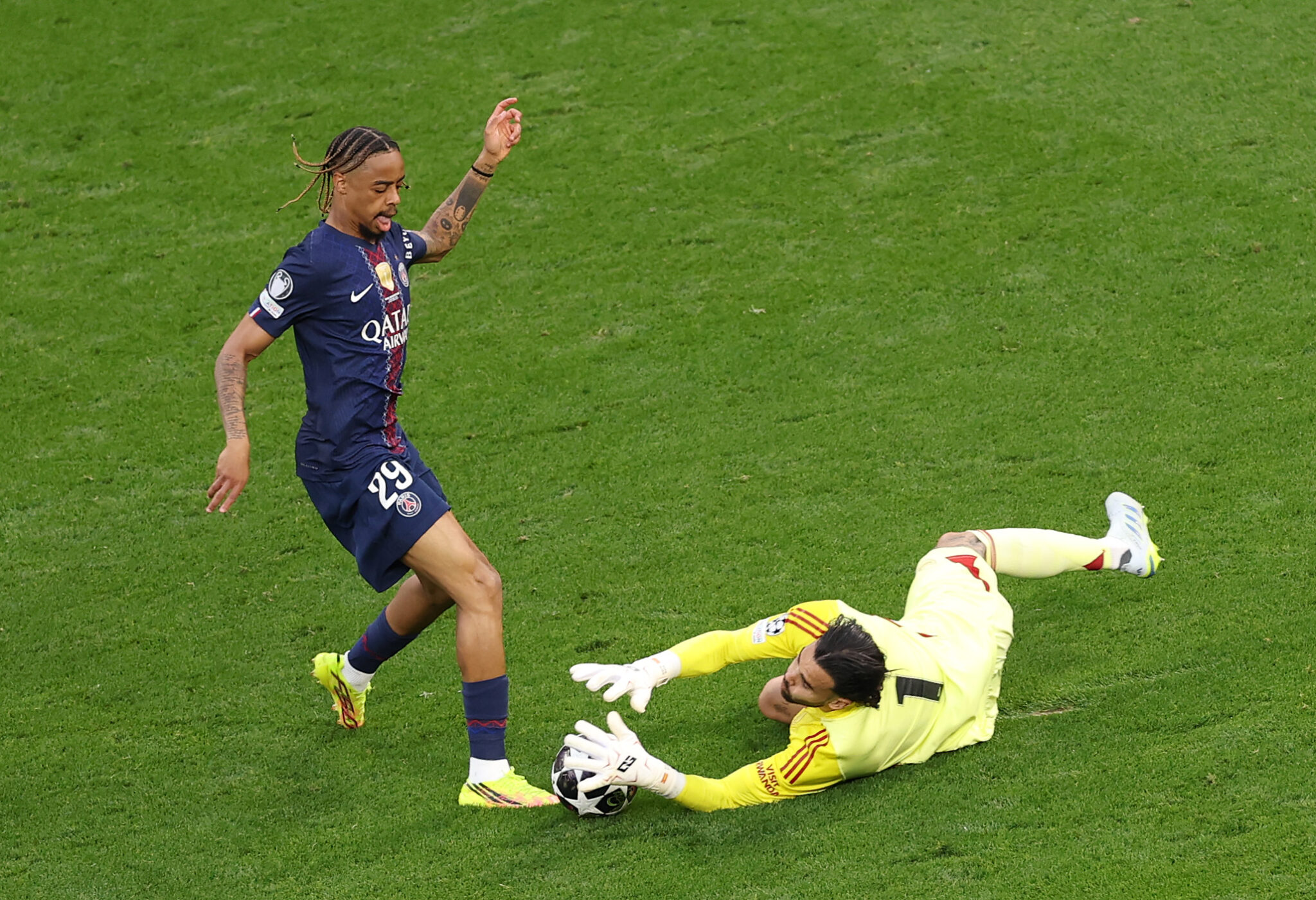 PSG player Bradley Barcola attempts to shoot past David Raya of Arsenal during the UEFA Champions League Final 2026 match between Paris Saint-Germain and Arsenal FC at Puskas Arena on May 30, 2026 in Budapest, Hungary.