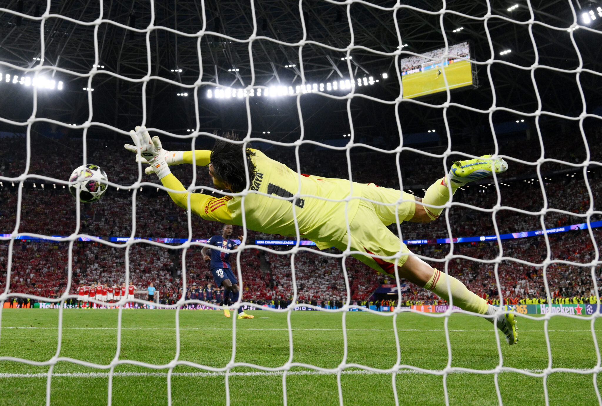 David Raya of Arsenal saves the third penalty from Nuno Mendes of Paris Saint-Germain in the penalty shoot out during the UEFA Champions League Final 2026 match between Paris Saint-Germain and Arsenal FC at Puskas Arena on May 30, 2026 in Budapest, Hungary.