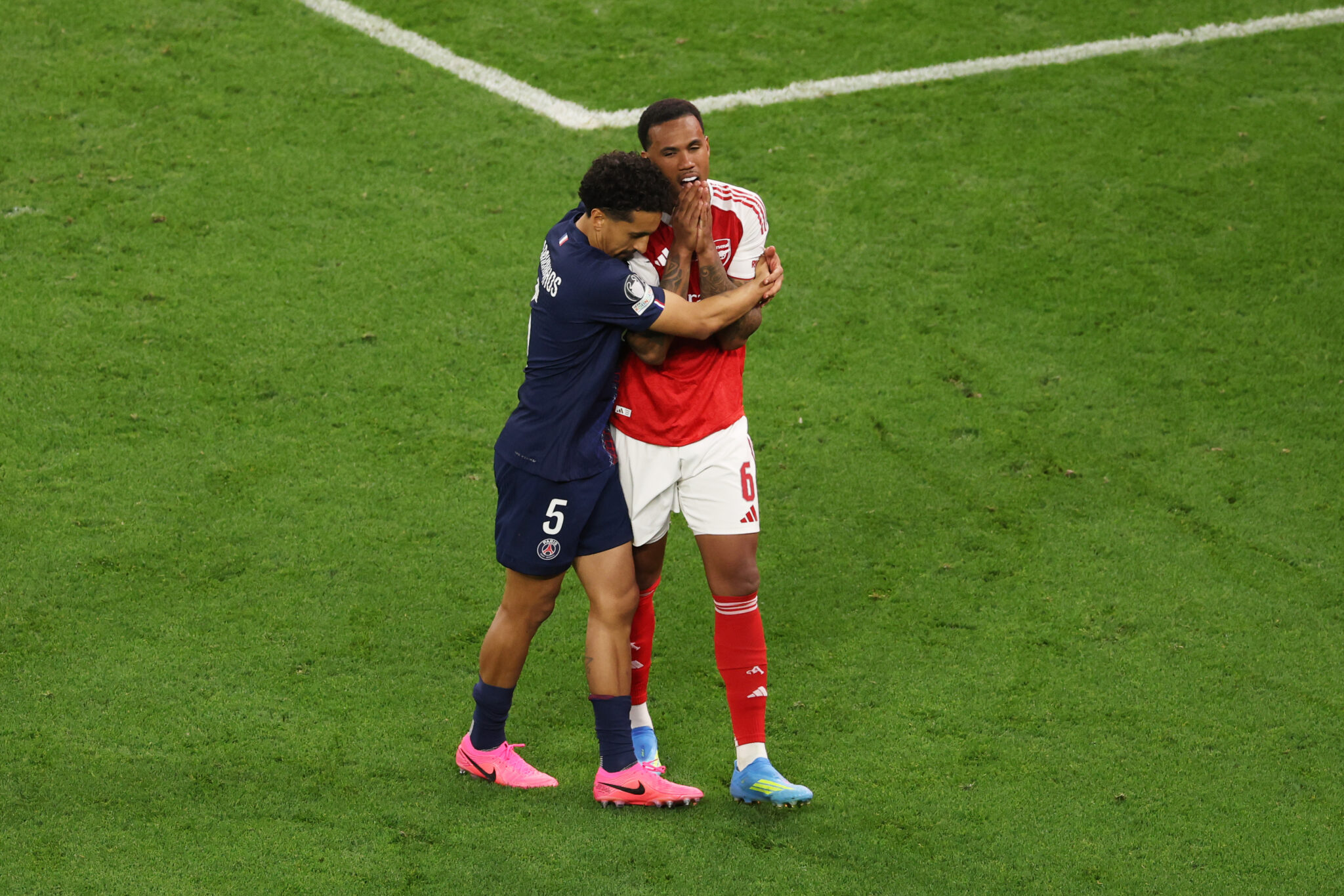 Gabriel of Arsenal is hugged by Marquinhos of PSG after missing the team's fifth penalty in the penalty shoot out during the UEFA Champions League Final 2026 match between Paris Saint-Germain and Arsenal FC at Puskas Arena on May 30, 2026 in Budapest, Hungary.
