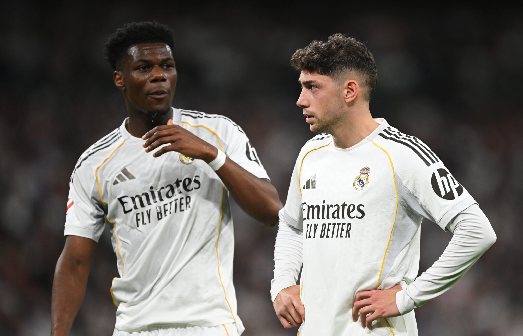 Real Madrid players Aurelien Tchouameni and Federico Valverde look on during the LaLiga EA Sports match between Real Madrid CF and Girona FC at Estadio Santiago Bernabeu on April 10, 2026 in Madrid, Spain.