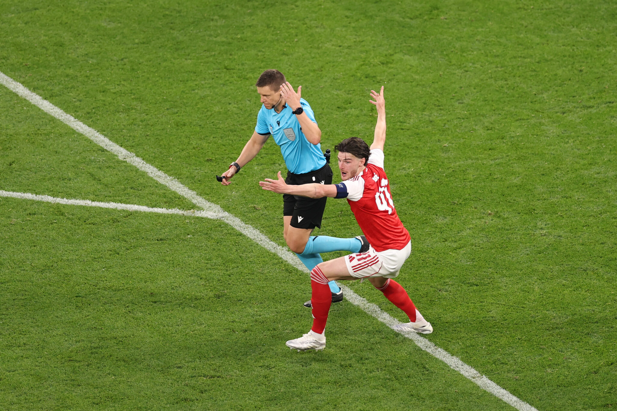 Referee Daniel Siebert waves away Declan Rice of Arsenal reacts after Noni Madueke of Arsenal (not pictured) is challenged by Nuno Mendes of PSG (not pictured) during the UEFA Champions League Final 2026 match between Paris Saint-Germain and Arsenal FC at Puskas Arena on May 30, 2026 in Budapest, Hungary.