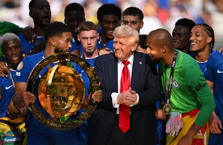 U.S. President Donald Trump interacts with Reece James #24 of Chelsea FC as he holds the FIFA Club World Cup trophy following the FIFA Club World Cup 2025 Final match between Chelsea FC and Paris Saint-Germain at MetLife Stadium on July 13, 2025 in East Rutherford, New Jersey.