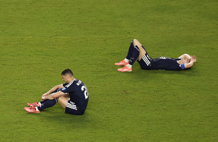 Scotland players Scott McKenna #26 and Kenny McLean #23 react after the 0-3 loss during the FIFA World Cup 2026 Group C match between Scotland and Brazil at Miami Stadium on June 24, 2026 in Miami Gardens, Florida.