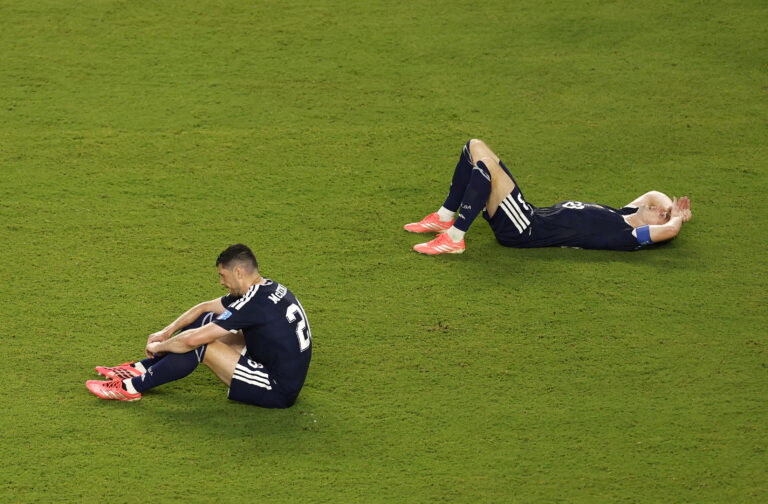 Scotland players Scott McKenna #26 and Kenny McLean #23 react after the 0-3 loss during the FIFA World Cup 2026 Group C match between Scotland and Brazil at Miami Stadium on June 24, 2026 in Miami Gardens, Florida.