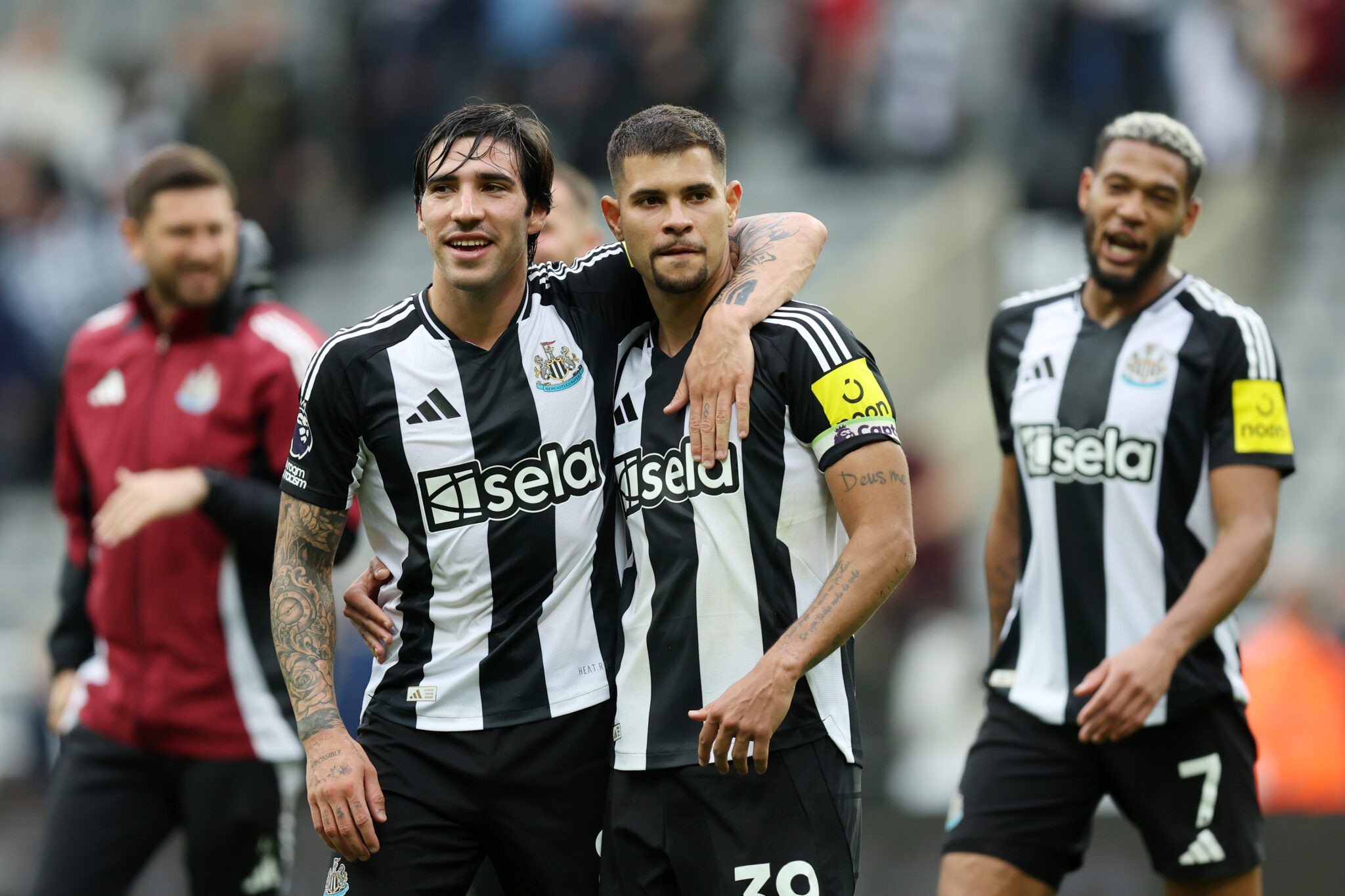 Sandro Tonali of Newcastle United celebrates victory with teammate Bruno Guimaraes after the Premier League match between Newcastle United FC and Spurs at St James' Park on September 01, 2024 in Newcastle upon Tyne, England.