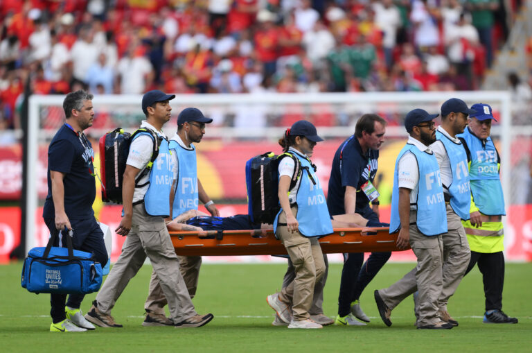 Manuel Ugarte #5 of Man Utd and Uruguay is stretched off after an injury during the FIFA World Cup 2026 Group H match between Uruguay and Spain at Guadalajara Stadium on June 26, 2026 in Zapopan, Mexico.