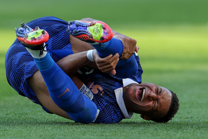 Kylian Mbappe #10 of France reacts after kicked by Juan Jose Caceres #4 (not pictured) of Paraguay during the FIFA World Cup 2026 Round of 16 match between Paraguay and France at Philadelphia Stadium on July 04, 2026 in Philadelphia, Pennsylvania.